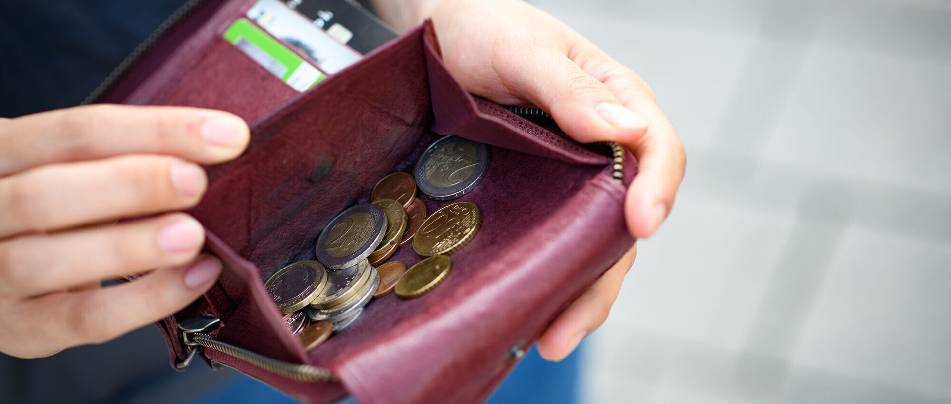 There are many coins of different denominations in a purse.