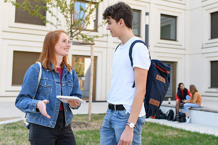 Students are talking in the B6 courtyard. Link: Career Opportunities