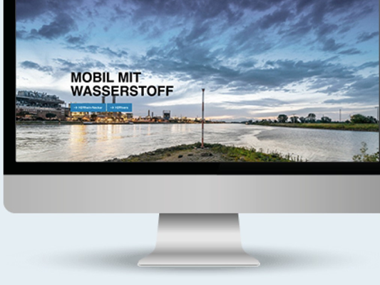 Computer screen shows H2 Rhein-Neckar website with lettering: “Mobile with hydrogen”.