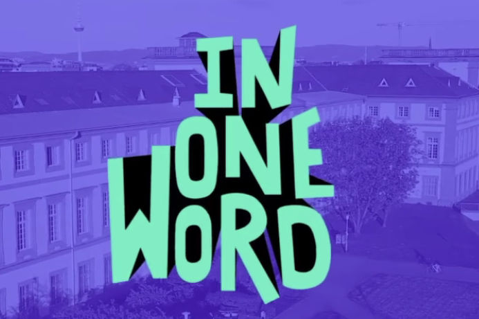 Im Mittelpunkt stehen, in grüner Schriftfarbe, die Worte „In one word“. Der Hintergrund zeigt das Mannheimer Schloss und darüber liegt ein blauer Filter.