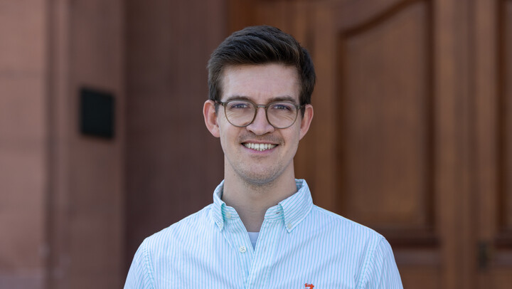 Philipp Menge. He is wearing a light shirt.