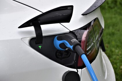 Close-up of an electric vehicle being charged