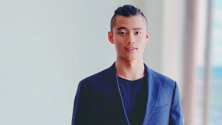 Ziheng Sun wearing a dark suit.