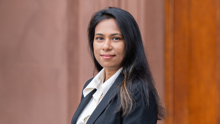 Poulomi Pal wearing a black suit.