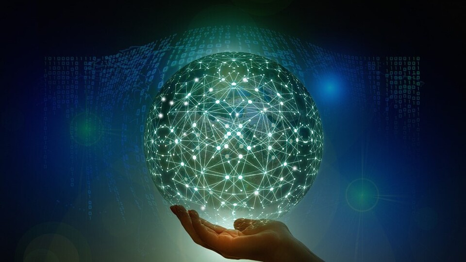 Eine Hand hält eine virtuelle Kugel, in der mit Lichtpunkten Verknüpfungen dargestellt sind.