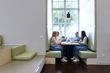 Students studying at a group table