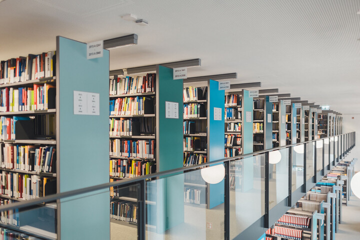 Several bookshelves in a library