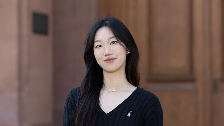 Ruochen Wang. She is wearing a black sweater.