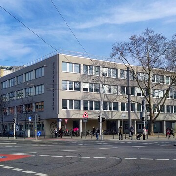 University building L1 in front of a blue sky