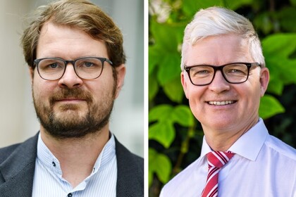 Philipp Kellmeyer und Jens-Uwe Franck tragen beide ein Hemd und eine Brille.