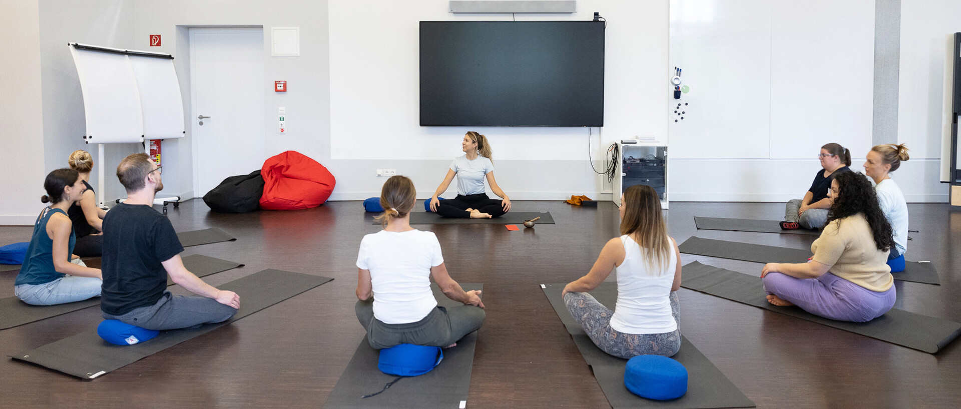 Staff members practicing yoga