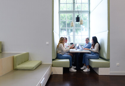 Students studying at a group table