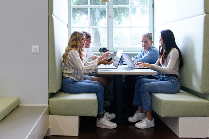 Students studying at a group table