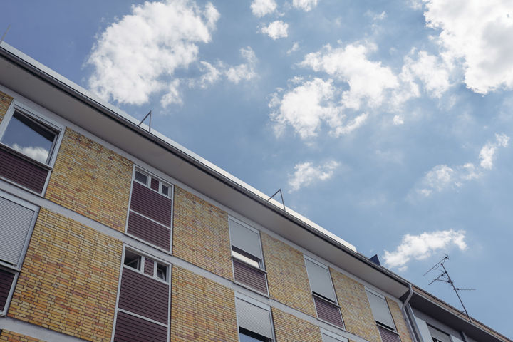 A building shot from below, the sky is visible