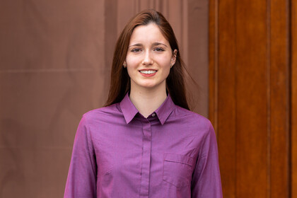 Kseniia Gorokhovska, wearing a purple shirt.