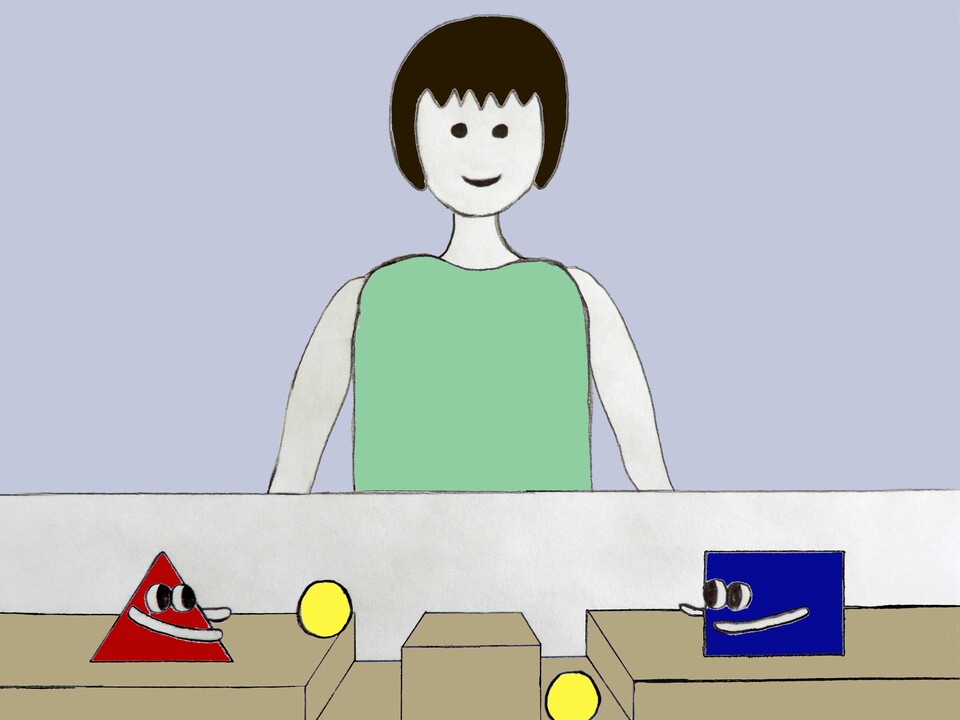 Eine Figur steht hinter einem Karton. Auf dem Karton stehen links ein rotes Dreieck und rechts ein blaues Rechteck mit Augen und Armen. Die Formen werfen gelbe Bälle in zwei Rillen vor ihnen.